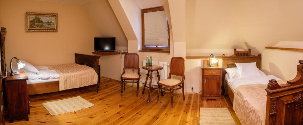 A bed or beds in a room at Boutique hotel Pracháreň