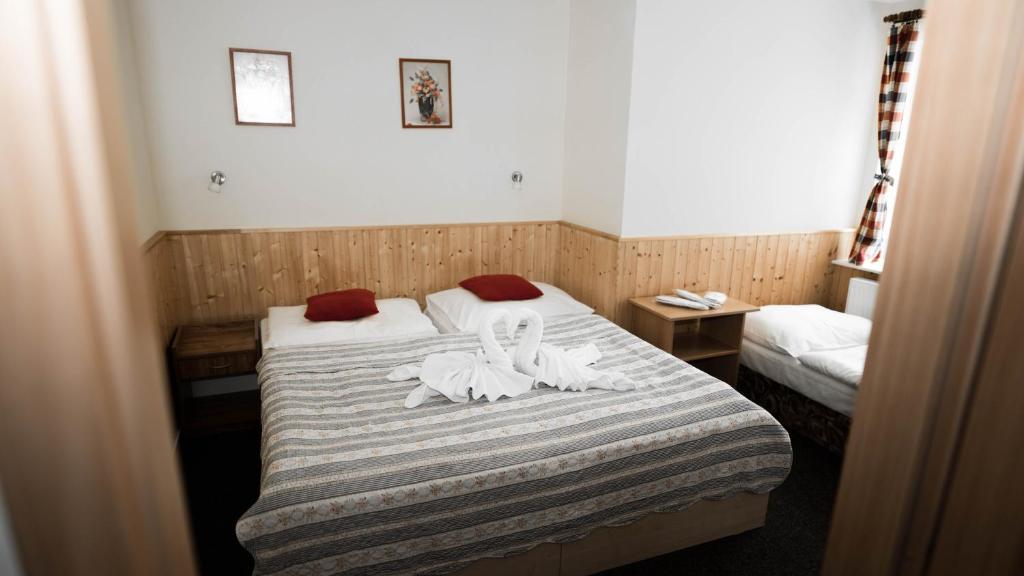 Postel nebo postele na pokoji v ubytování Hotel Atlas