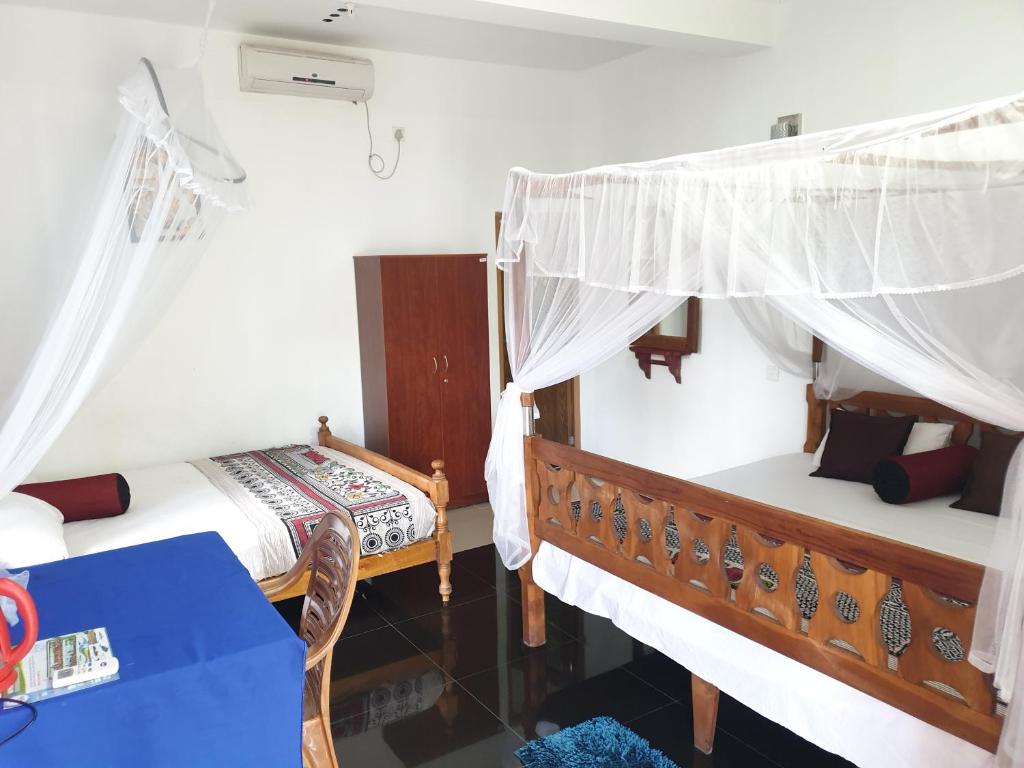 Postel nebo postele na pokoji v ubytování Liyanage Resort
