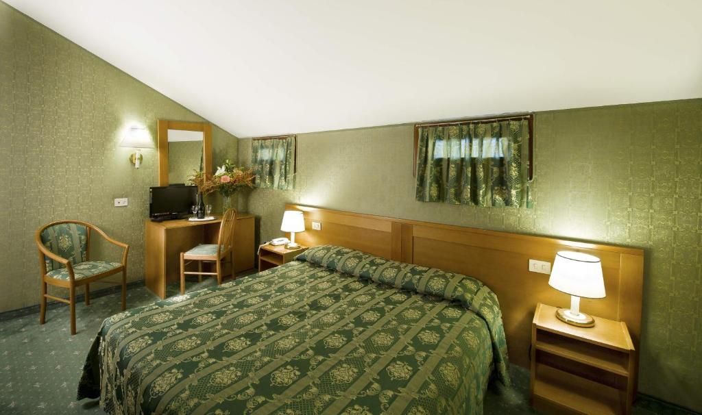 Postel nebo postele na pokoji v ubytování Hotel Nazionale