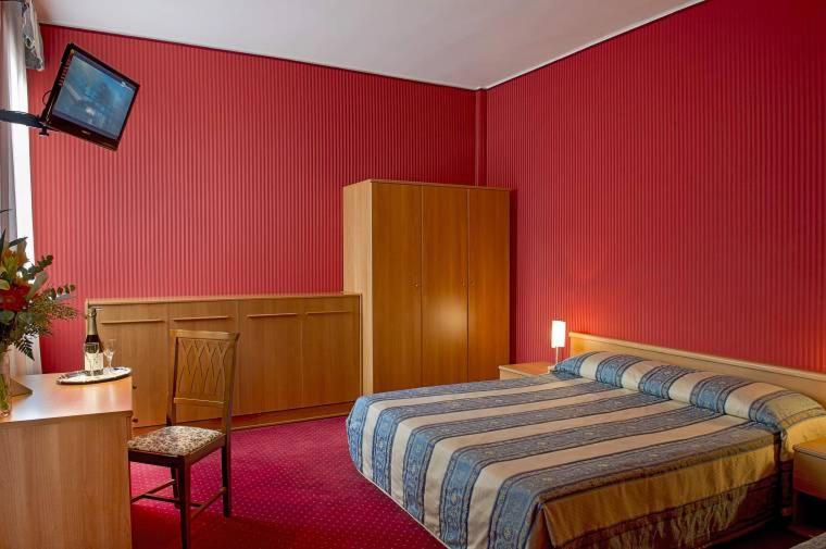 Postel nebo postele na pokoji v ubytování Hotel Nazionale