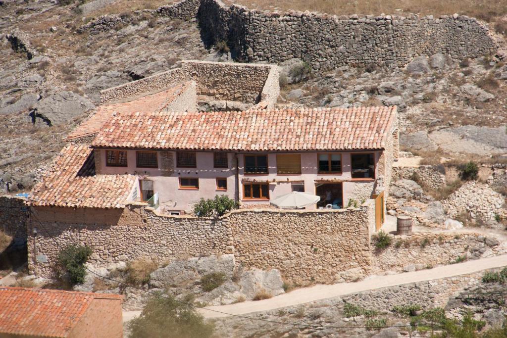 an aerial view of a house on a mountain at Corral De La Solana in Molinos