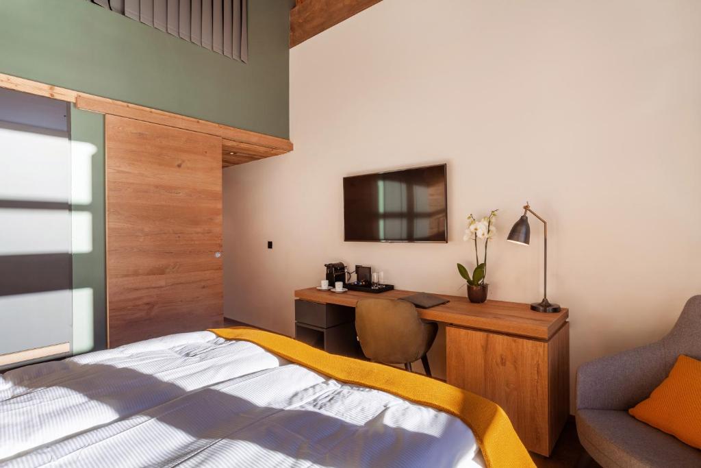 Postel nebo postele na pokoji v ubytování 22 Summits Boutique Hotel