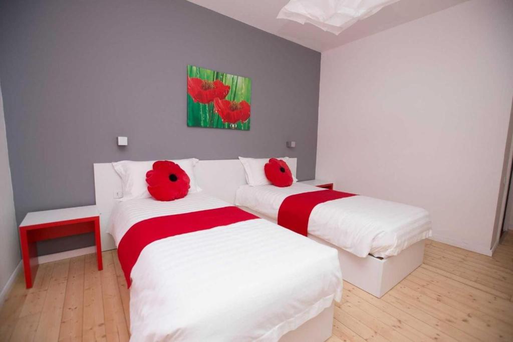 Postel nebo postele na pokoji v ubytování Hotel Rimini Tirana