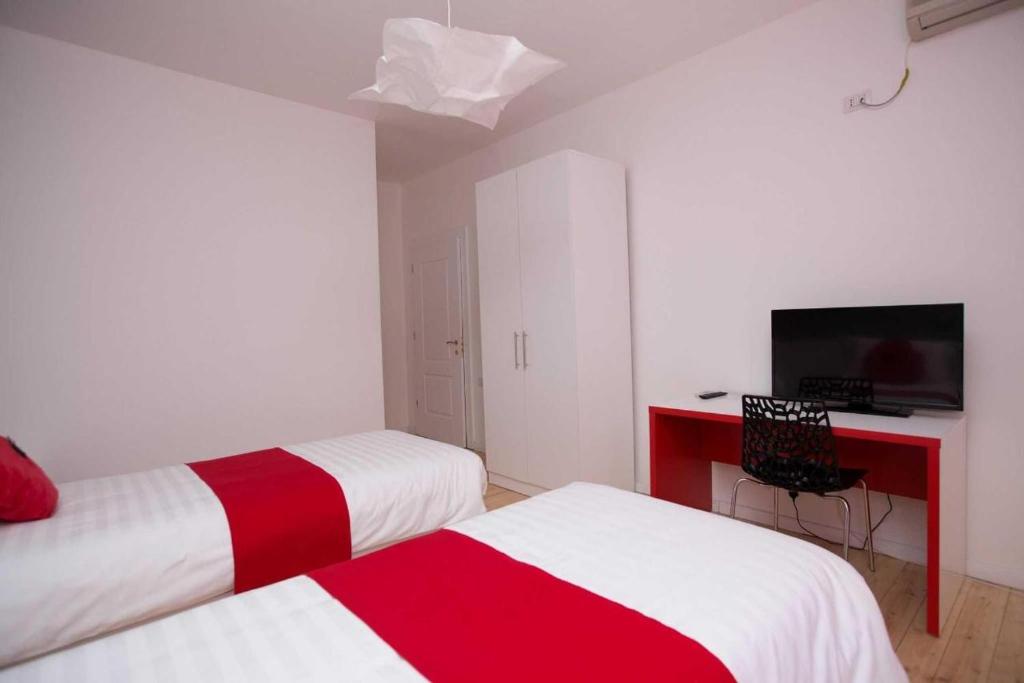 Postel nebo postele na pokoji v ubytování Hotel Rimini Tirana