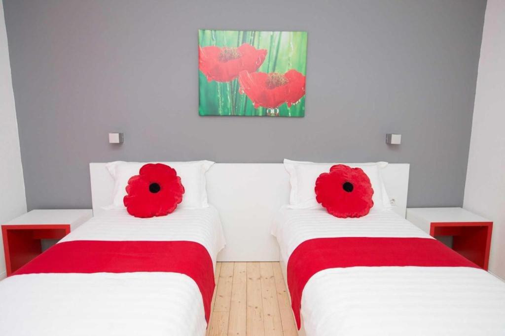 Postel nebo postele na pokoji v ubytování Hotel Rimini Tirana