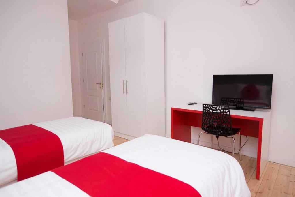 Postel nebo postele na pokoji v ubytování Hotel Rimini Tirana