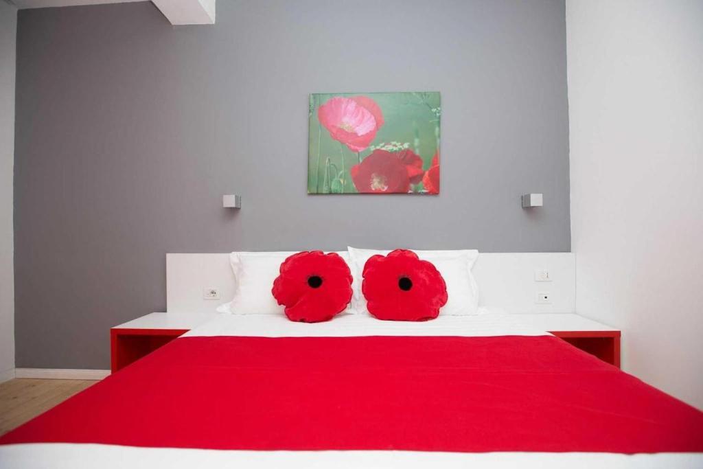 Postel nebo postele na pokoji v ubytování Hotel Rimini Tirana