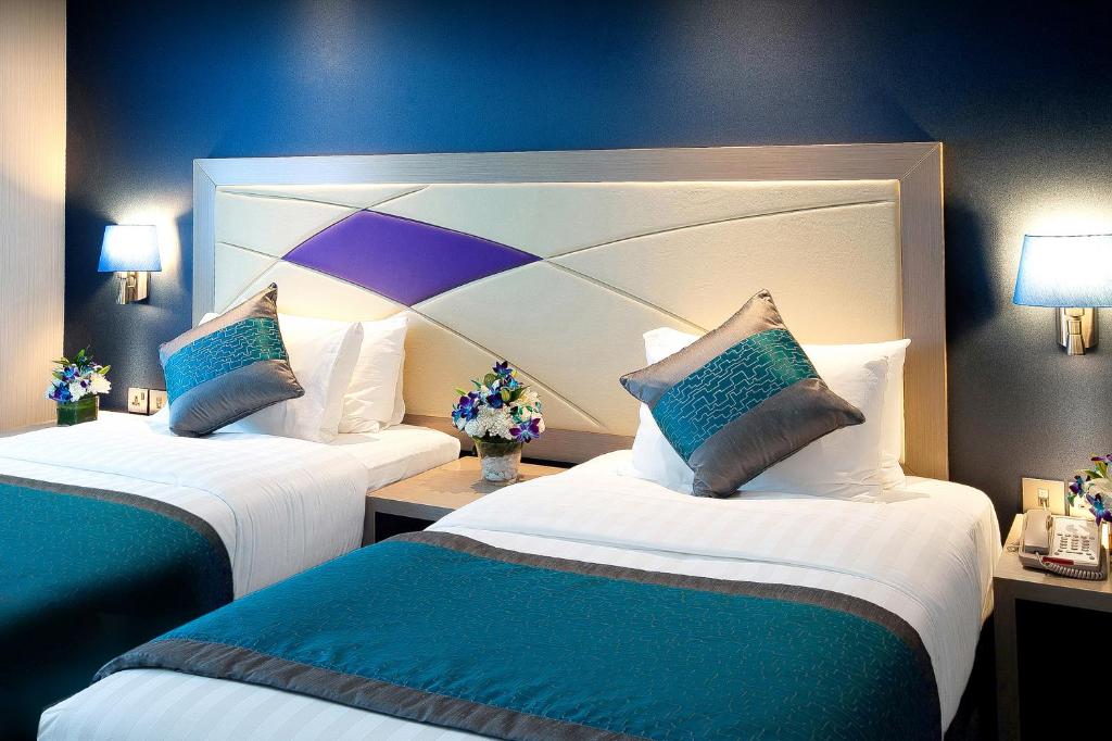 Postel nebo postele na pokoji v ubytování Al Sarab Hotel