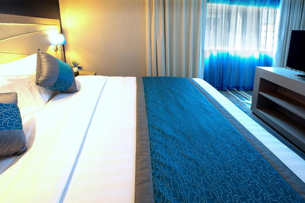 Postel nebo postele na pokoji v ubytování Al Sarab Hotel