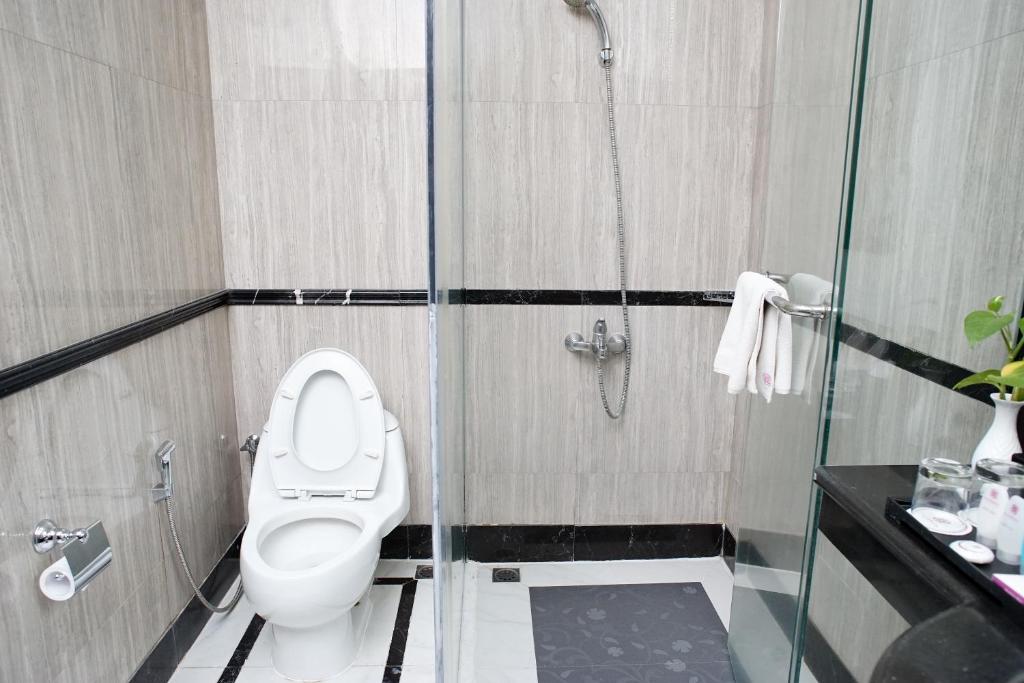Koupelna v ubytování Adhiwangsa Hotel
