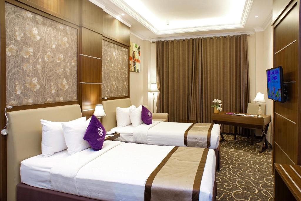 TV a/nebo společenská místnost v ubytování Adhiwangsa Hotel