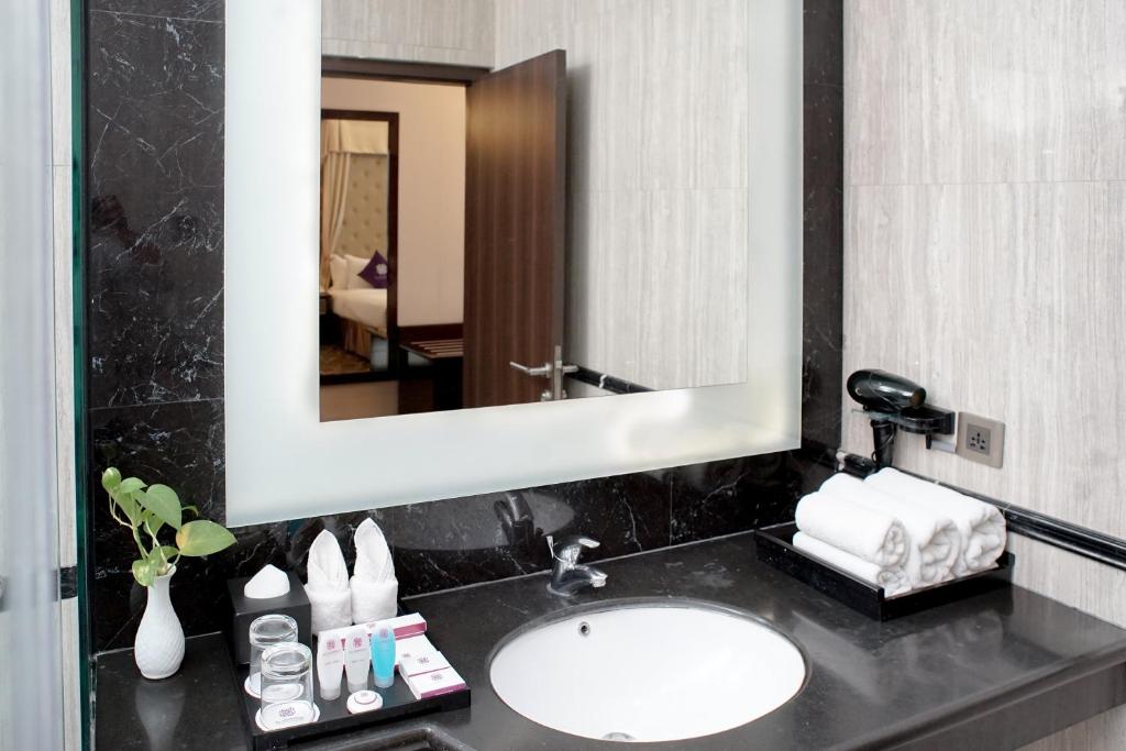 Koupelna v ubytování Adhiwangsa Hotel