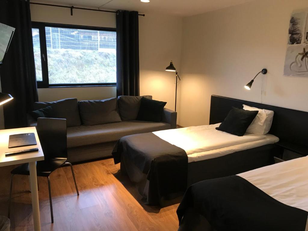 Postel nebo postele na pokoji v ubytování Hotel Småland