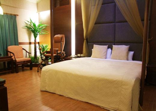 Postel nebo postele na pokoji v ubytování Keton Motel Hualien