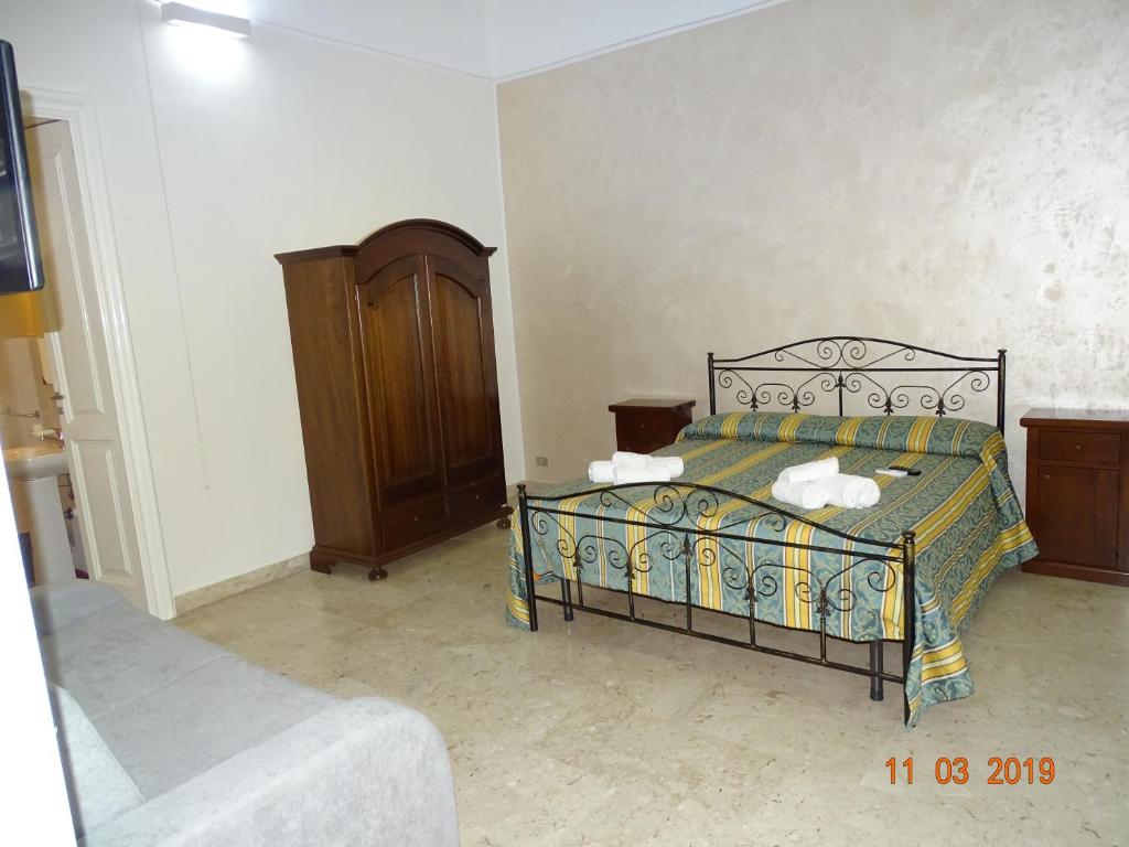 Postel nebo postele na pokoji v ubytování b&b new antico palazzo