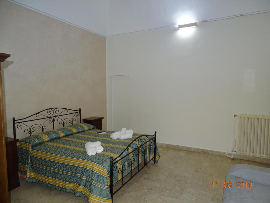 Postel nebo postele na pokoji v ubytování b&b new antico palazzo