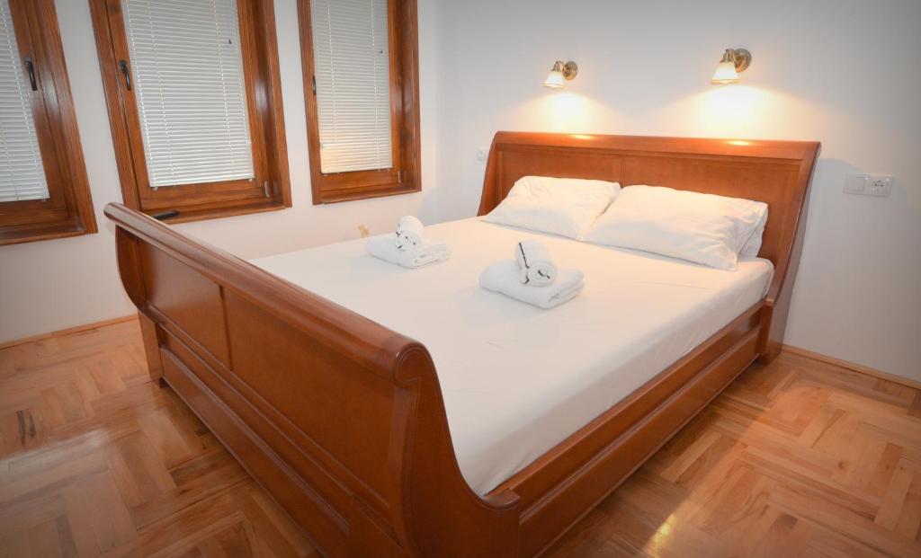 Postel nebo postele na pokoji v ubytování Mladenovic apartments