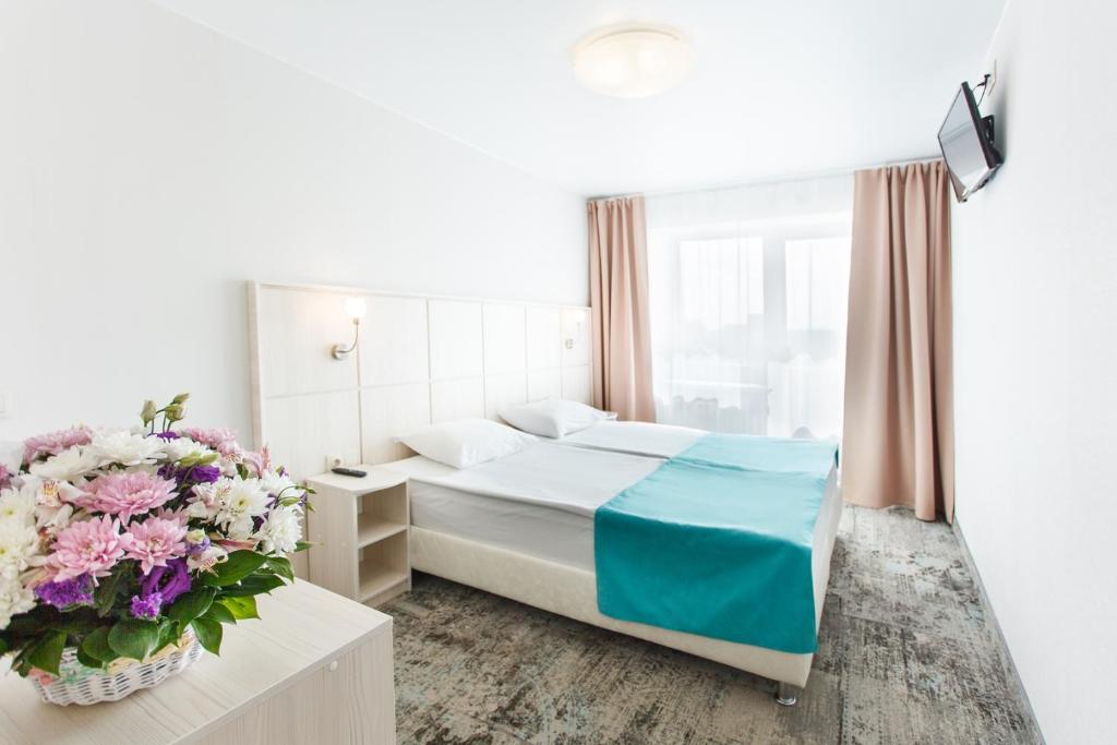 
Кровать или кровати в номере Отель Охтинская
