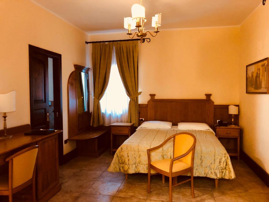 Postel nebo postele na pokoji v ubytování Relais Il Mulino