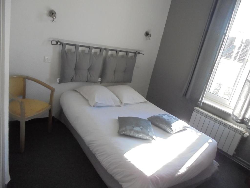 Postel nebo postele na pokoji v ubytování L'ESPERANCE