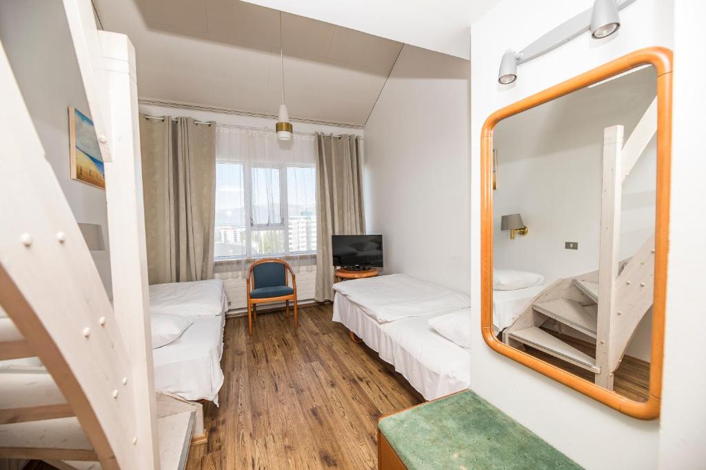 Postel nebo postele na pokoji v ubytování Hotel Orkin