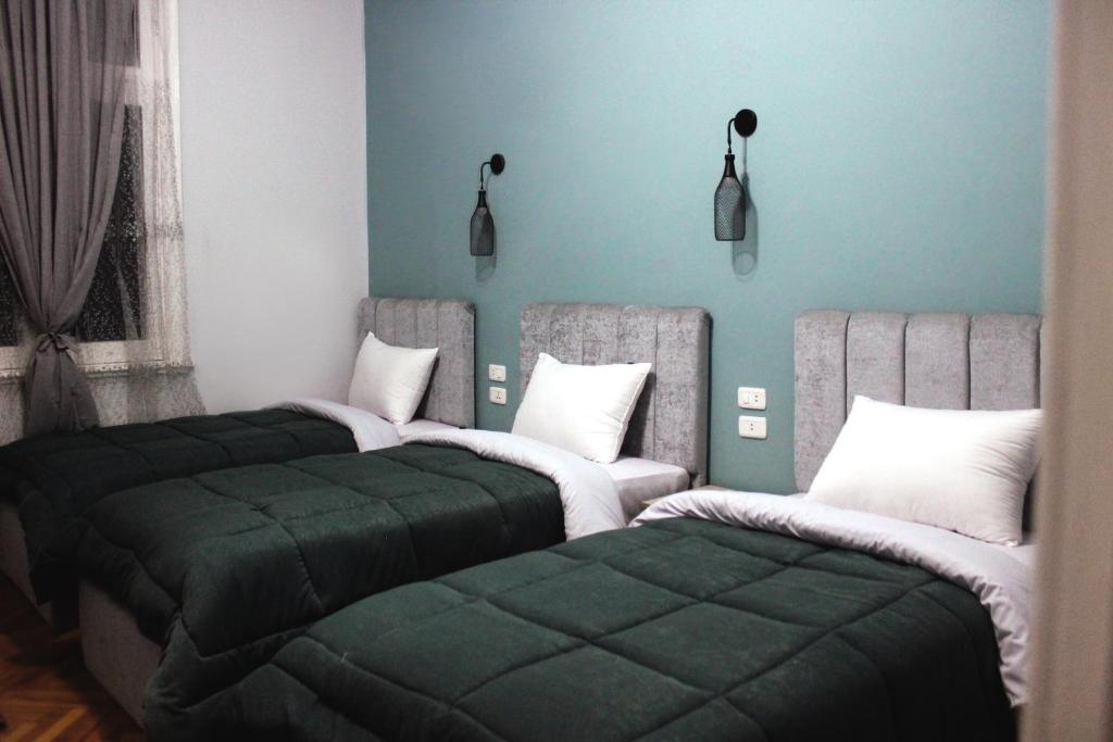 Postel nebo postele na pokoji v ubytování Cheers Hostel Cairo