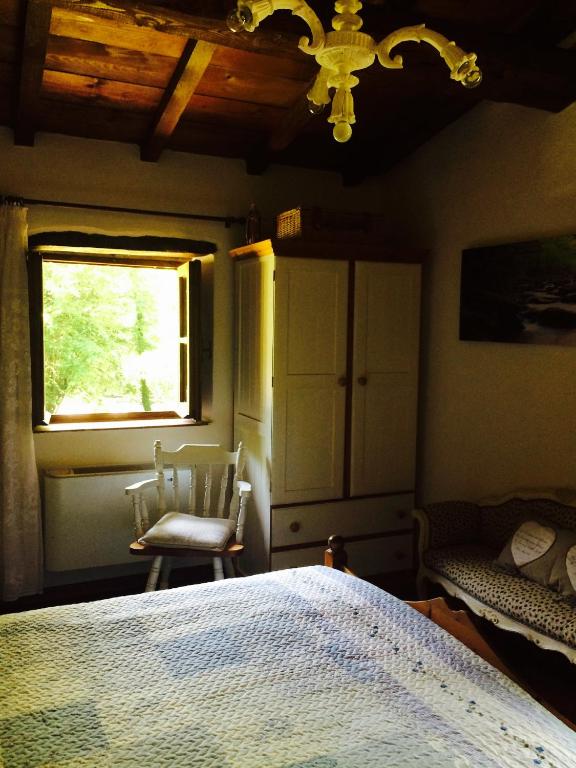 A bed or beds in a room at Relax totale nel Bosco Lucca