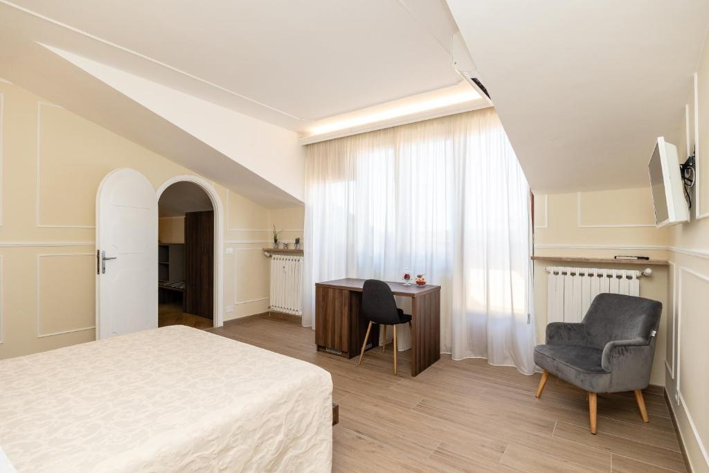 Posteľ alebo postele v izbe v ubytovaní Scaligero Rooms