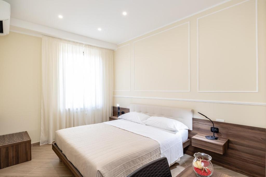 Posteľ alebo postele v izbe v ubytovaní Scaligero Rooms