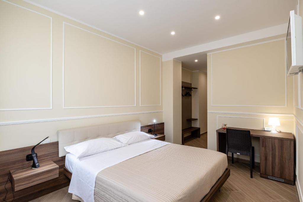 Posteľ alebo postele v izbe v ubytovaní Scaligero Rooms