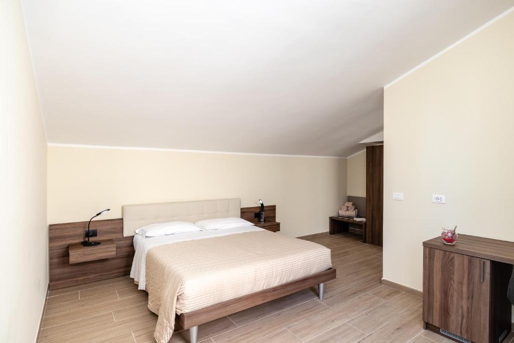 Posteľ alebo postele v izbe v ubytovaní Scaligero Rooms
