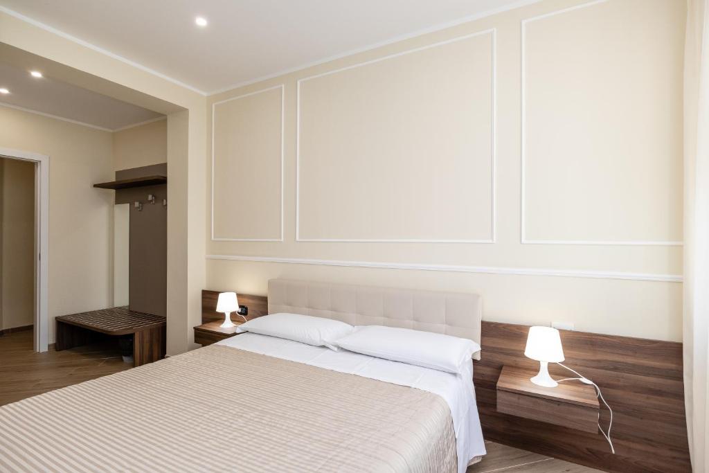 Posteľ alebo postele v izbe v ubytovaní Scaligero Rooms