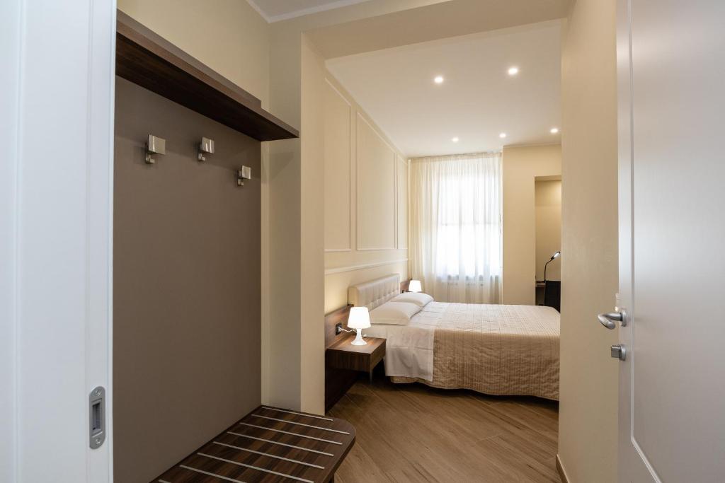 Posteľ alebo postele v izbe v ubytovaní Scaligero Rooms