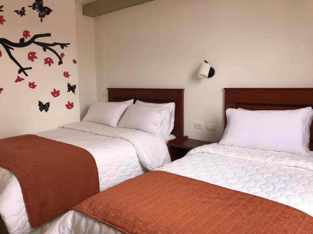 Postel nebo postele na pokoji v ubytování Hotel Seny