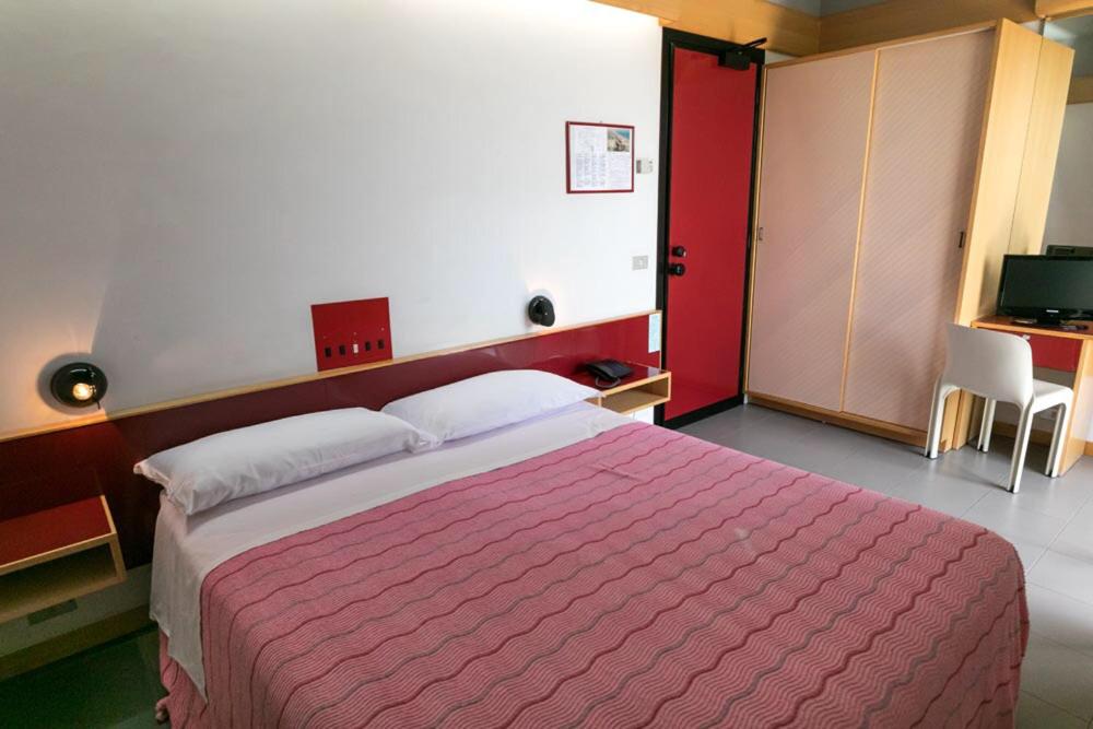 Postel nebo postele na pokoji v ubytování Hotel Giglio