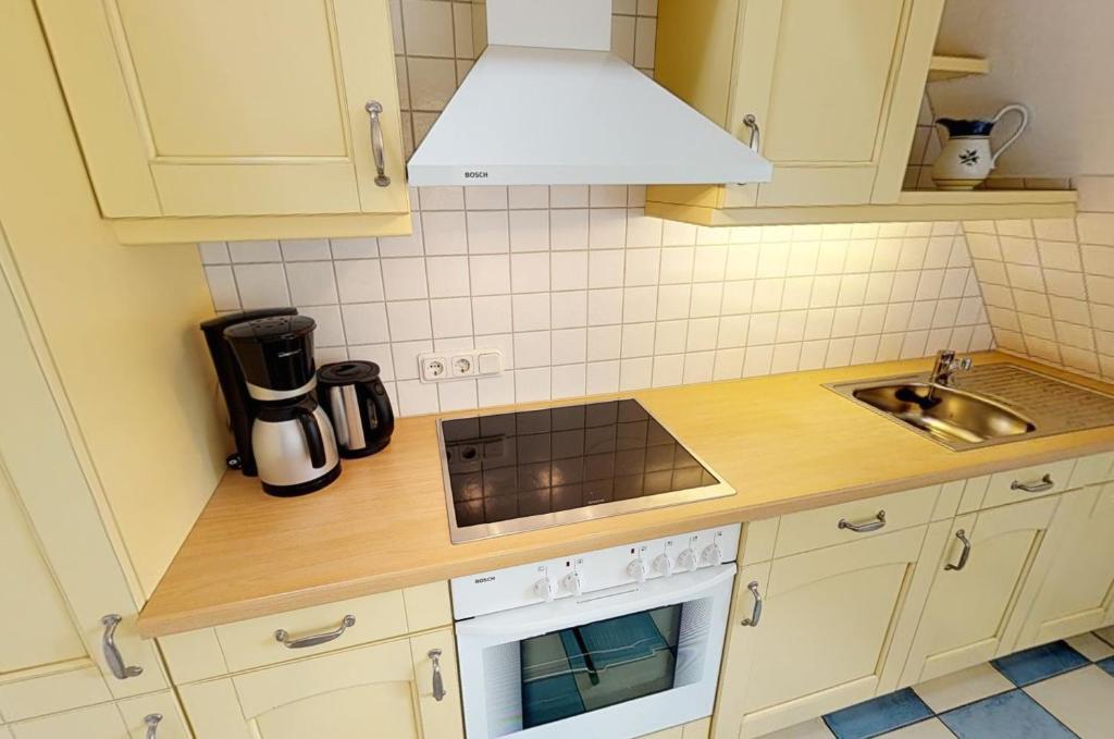 Kuchyň nebo kuchyňský kout v ubytování Friesenhof, Haus Hafis Wohnung 8