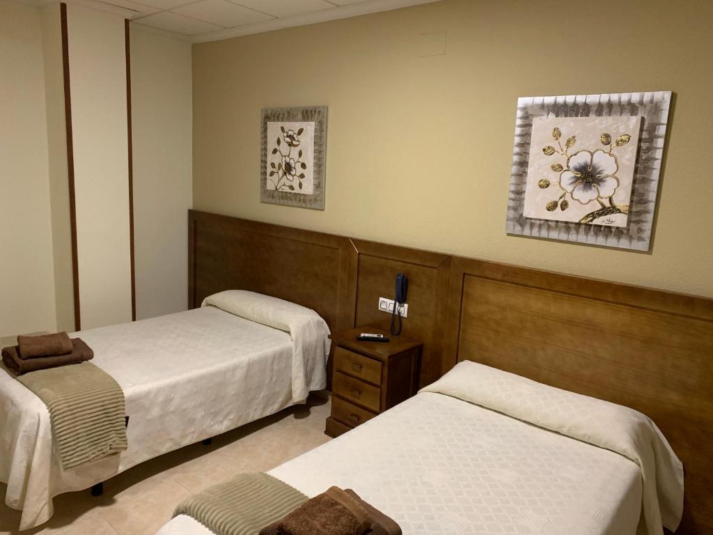 Postel nebo postele na pokoji v ubytování Hotel Don Juan