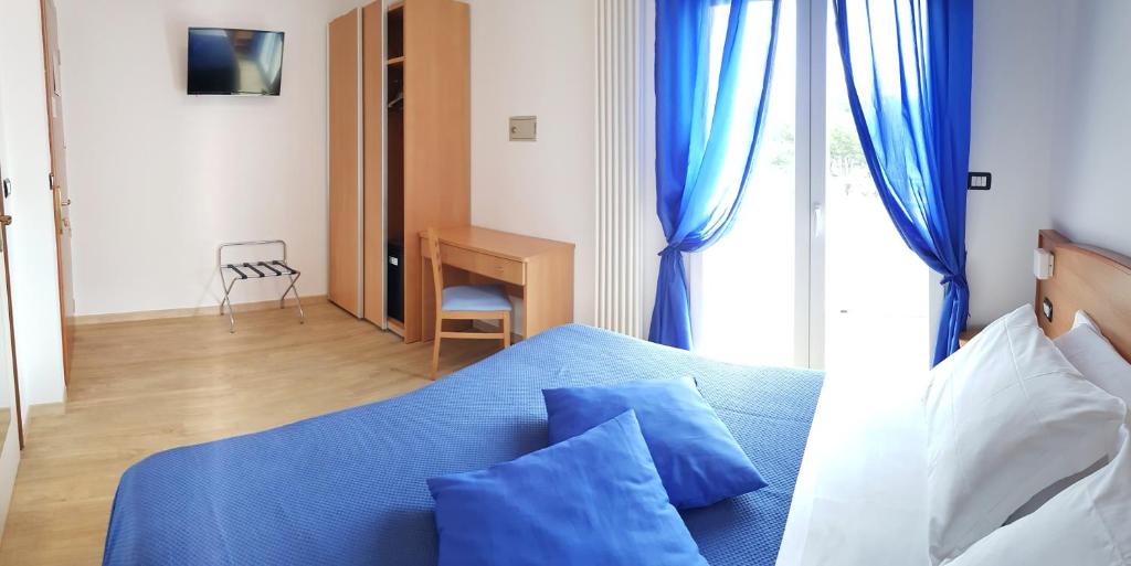 Кровать или кровати в номере Hotel Mare Blu -- boutique