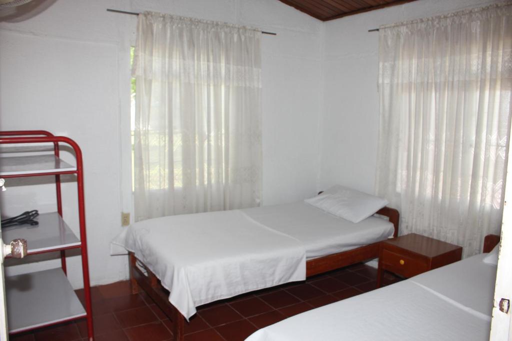 Postel nebo postele na pokoji v ubytování Hotel Campestre CENVATURS