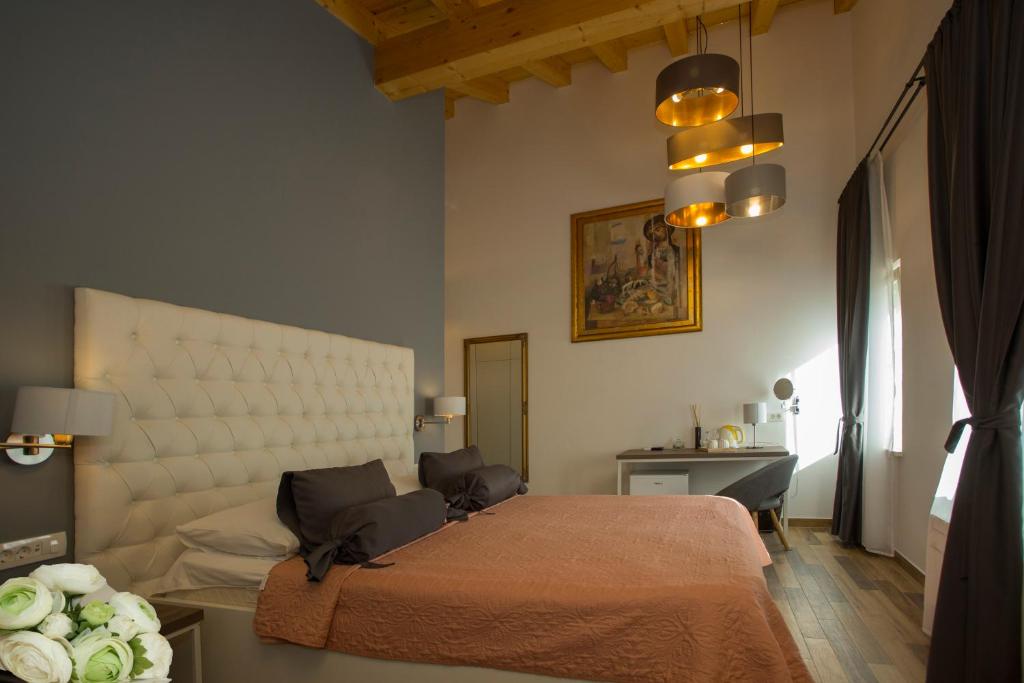 Posteľ alebo postele v izbe v ubytovaní Aspalathos Residence