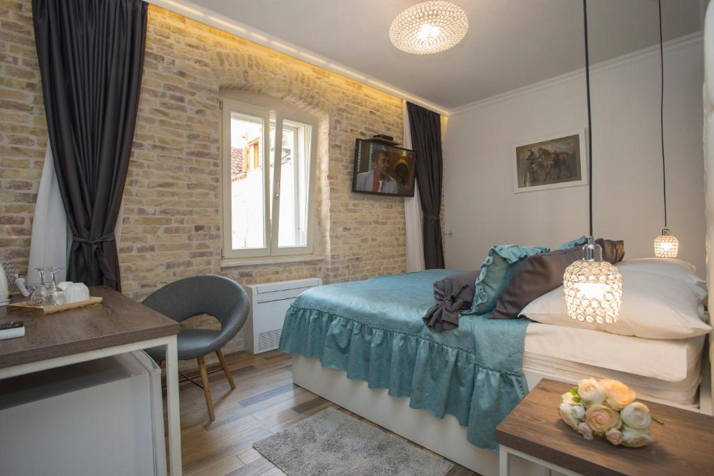 Posteľ alebo postele v izbe v ubytovaní Aspalathos Residence