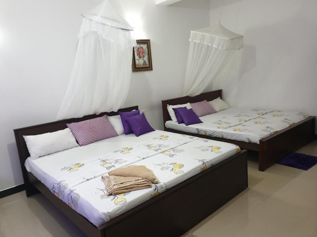 Postel nebo postele na pokoji v ubytování Liyanage Resort