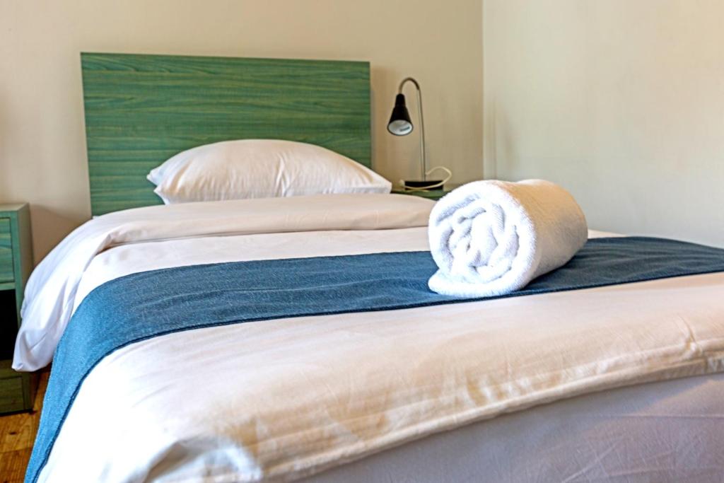 Letto o letti in una camera di The Sydney Hotel