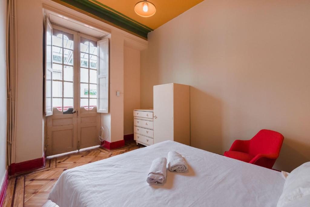 Postel nebo postele na pokoji v ubytování Hostal R10