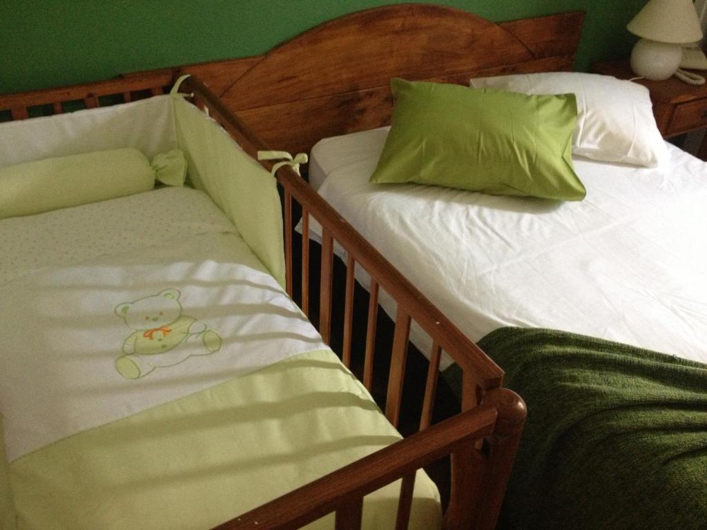 Postel nebo postele na pokoji v ubytování Hotel Alcides