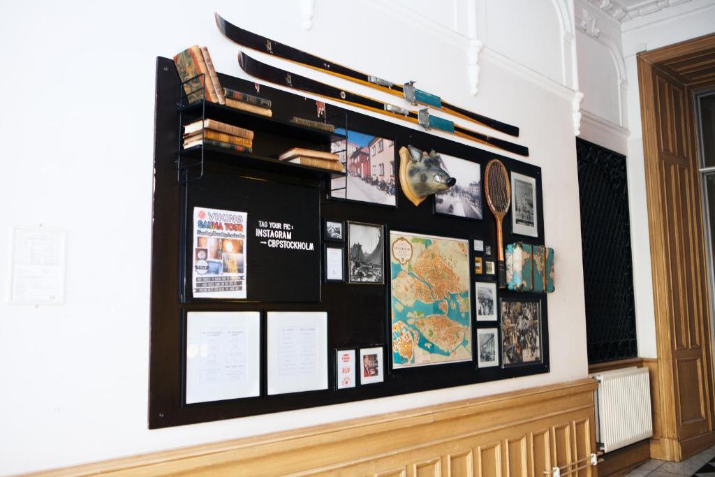 a display wall in a room with a bunch of objects at City Backpackers Hostel in Stockholm