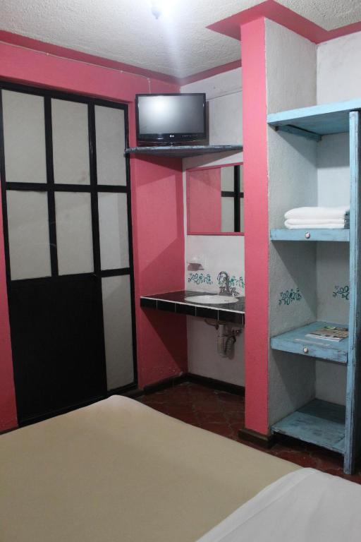 Postel nebo postele na pokoji v ubytování Hotel Posada Chamacuero