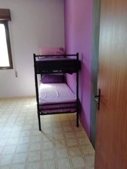 Łóżko lub łóżka w pokoju w obiekcie Villa Vacanze Giuseppe