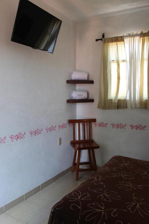 Postel nebo postele na pokoji v ubytování Hotel Posada Chamacuero